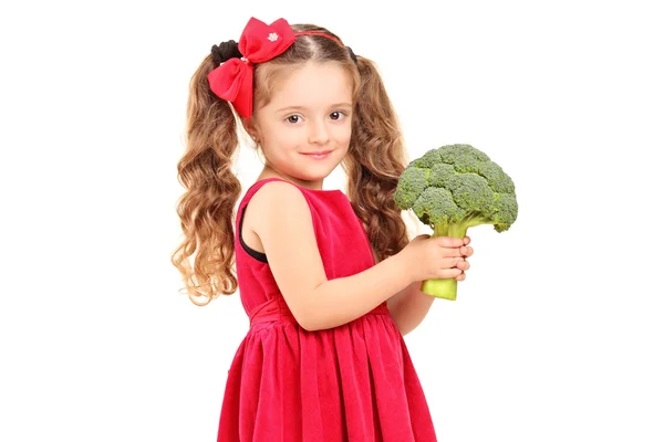 Girl holding broccoli — Stock Photo, Image