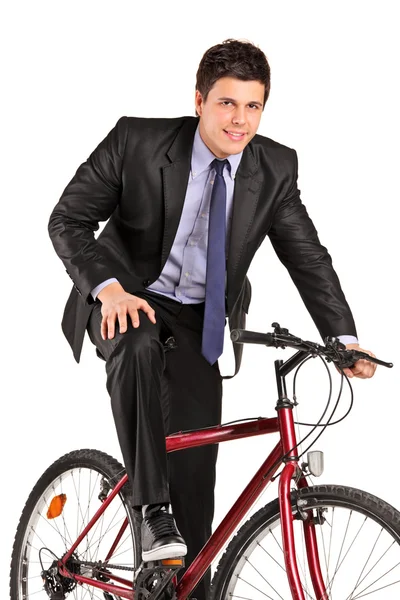 Businessman posing on bicycle — Stock Photo, Image