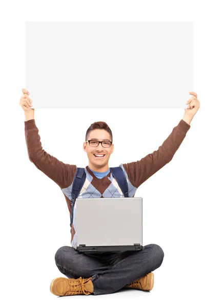 Male student holding blank pan — Stock Photo, Image