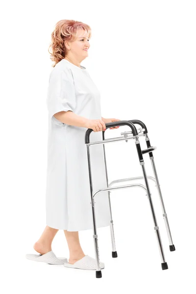 Female patient walking with walker — Stock Photo, Image