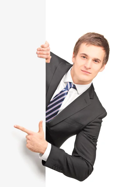 Businessman pointing on blank panel — Stock Photo, Image