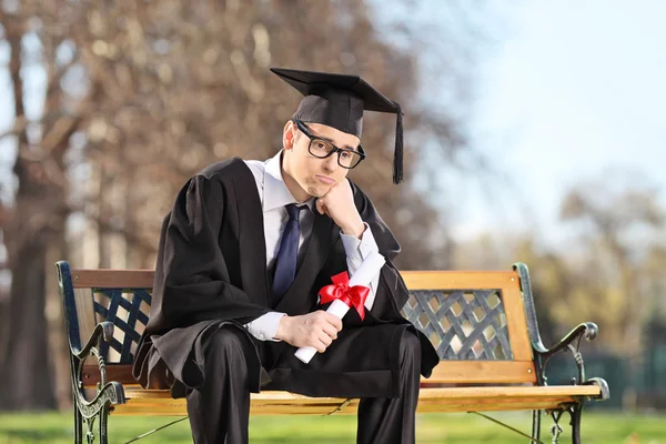 Sad college student in park — Stock Photo, Image