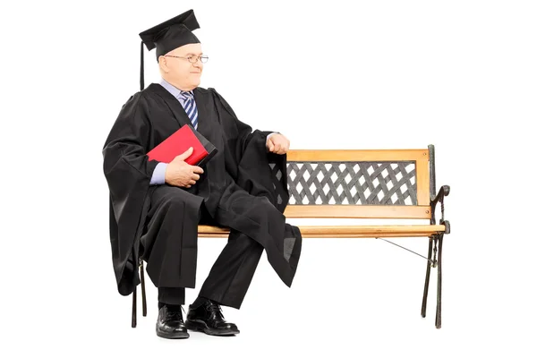 Mature man in graduation gown — Stock Photo, Image