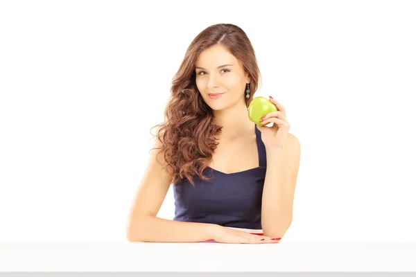 Female holding green apple — Stock Photo, Image