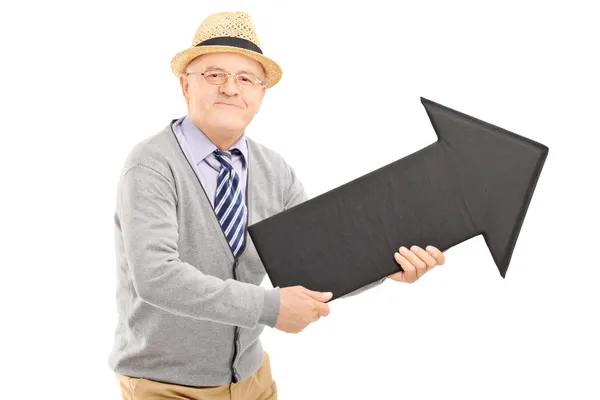 Senior gentleman holding big arrow — Stock Photo, Image