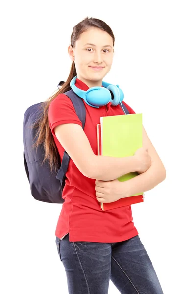 Adolescente feminina segurando cadernos — Fotografia de Stock