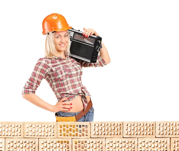 Female construction worker with radio — Stock Photo, Image