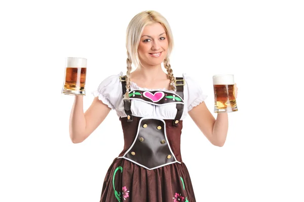Woman holding beer glasses — Stock Photo, Image