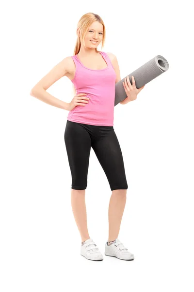 Female with an exercising mat — Stock Photo, Image