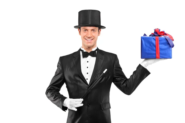 Magician holding gift — Stock Photo, Image