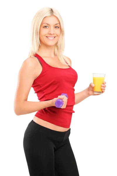 Female athlete holding dumbbell — Stock Photo, Image