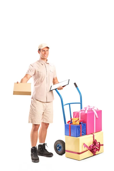 Person next to truck with presents — Stock Photo, Image