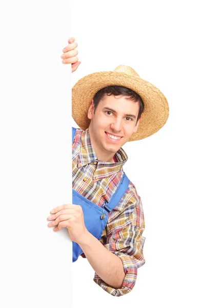 Male farmer holding white panel — Stock Photo, Image