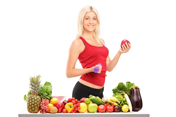 Female athlete holding dumbbell — Stock Photo, Image