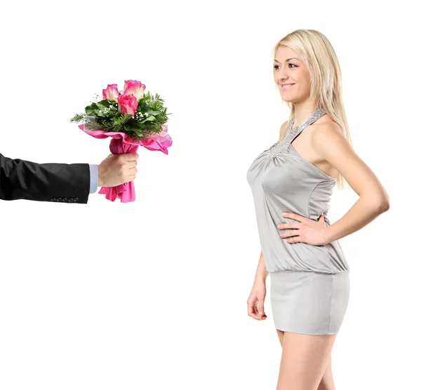 Hand giving flowers to woman — Stock Photo, Image