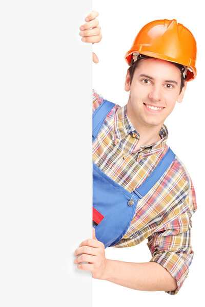 Construction worker behind panel