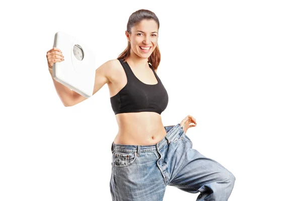 Weightloss woman holding weight scale — Stock Photo, Image