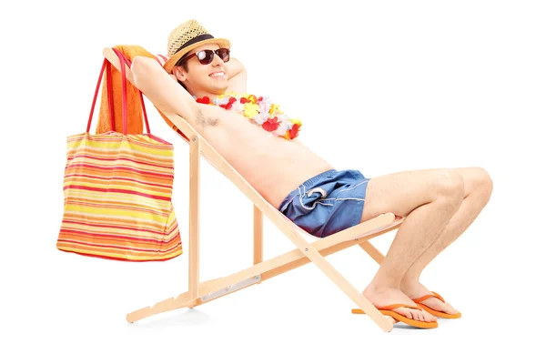 Man enjoying on sun lounger — Stock Photo, Image