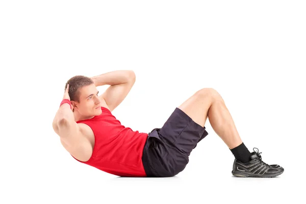 Man doing abbs on floor — Stock Photo, Image