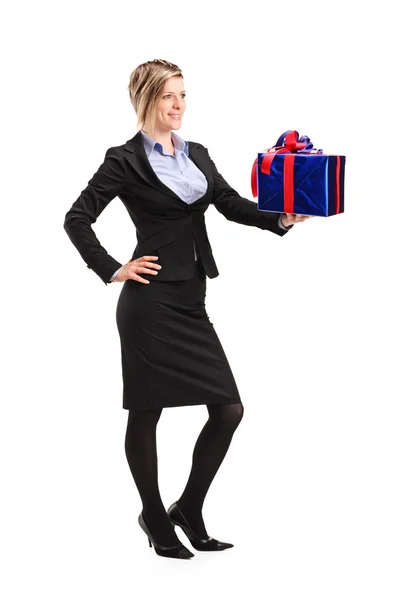 Attractive woman holding gift — Stock Photo, Image