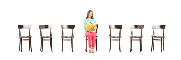 Student sitting on wooden chair