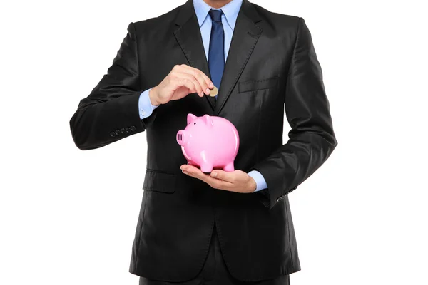 Putting coin into piggy bank — Stock Photo, Image