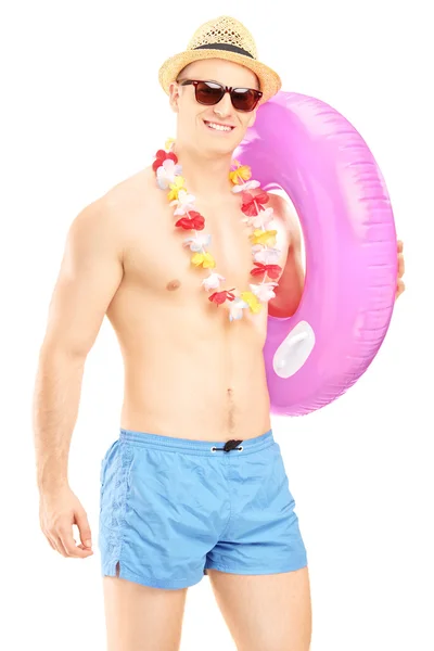 Shirtless fit guy holding swimming ring — Stock Photo, Image