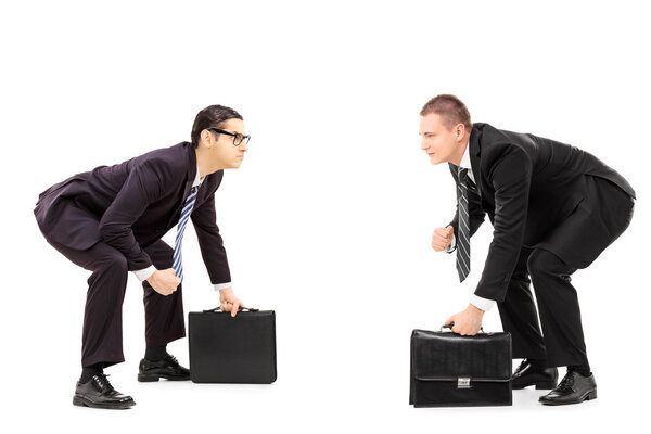 Businessmen standing in sumo wrestling stance