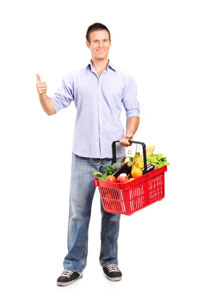 Homem segurando cesta de compras — Fotografia de Stock