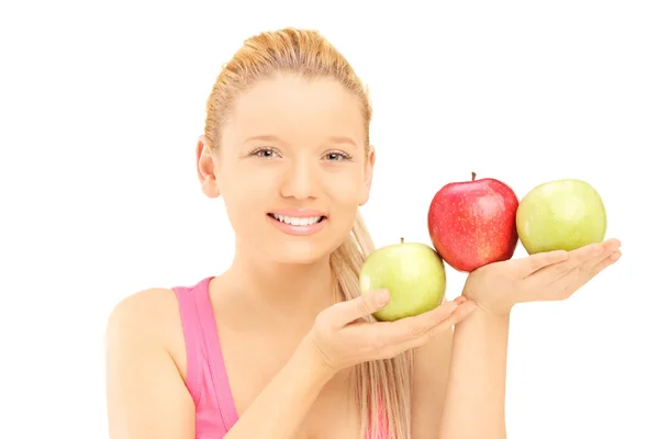 Young beautiful female holding apples — Stock Photo, Image