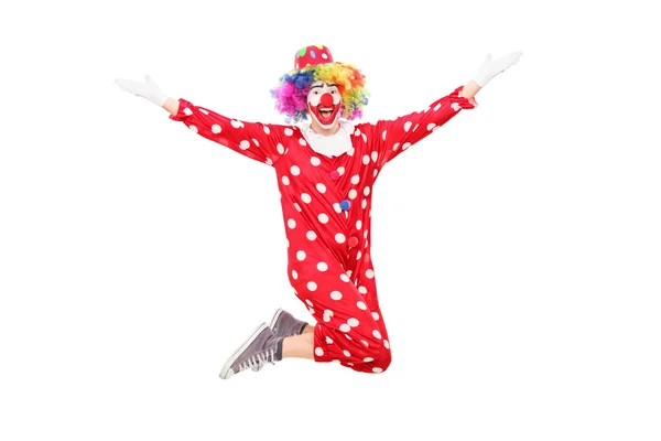 Manliga clown hoppar av glädje — Stockfoto