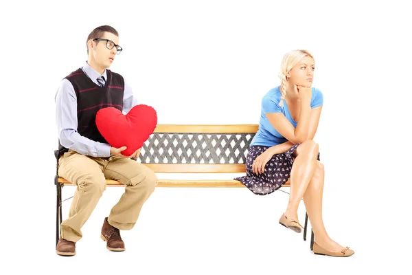 Male holding heart and disappointed female — Stock Photo, Image