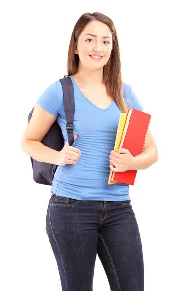 Estudante feminina segurando cadernos — Fotografia de Stock