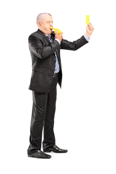 Businessman showing yellow card — Stock Photo, Image