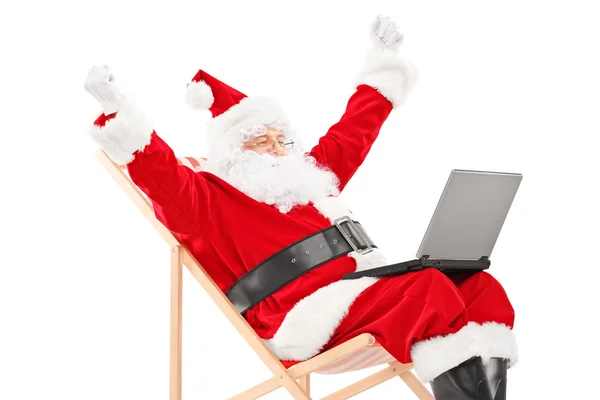 Kerstman met laptop — Stockfoto