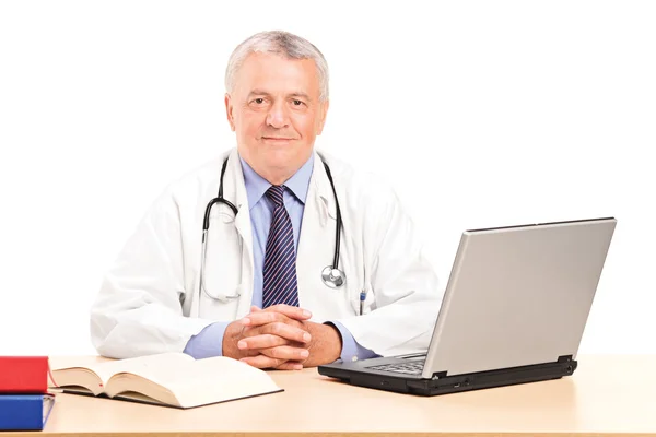 Mature doctor in office posing — Stock Photo, Image