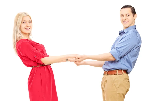 Young couple holding hands — Stock Photo, Image