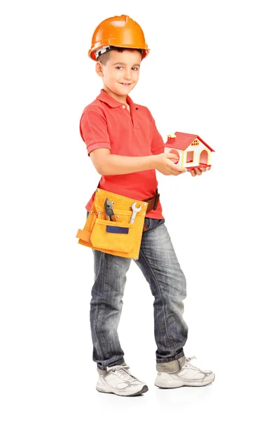 Child holding model of house — Stock Photo, Image