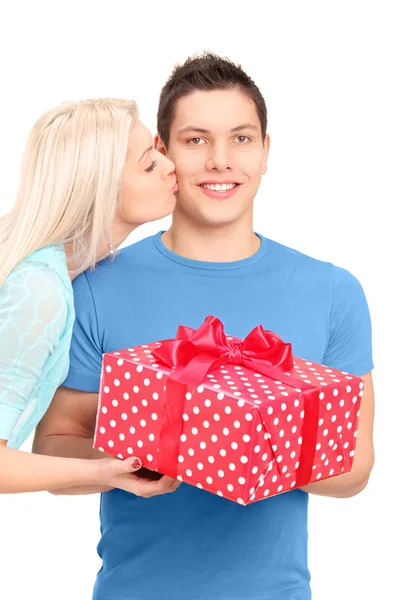 Guy receiving gift from girlfriend — Stock Photo, Image