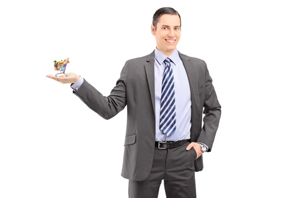 Man holding small shopping cart — Stock Photo, Image