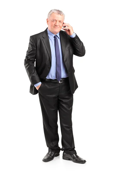 Mature businessman talking on phone — Stock Photo, Image