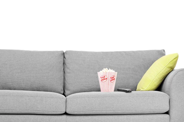 Modern sofa with popcorn box — Stock Photo, Image