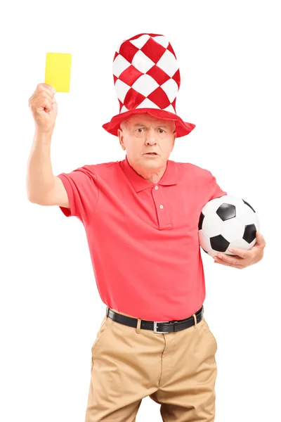 Ventilador de futebol segurando cartão amarelo — Fotografia de Stock