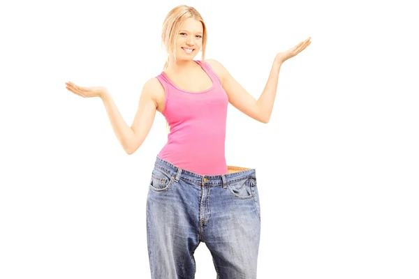 Weightless female with old jeans — Stock Photo, Image