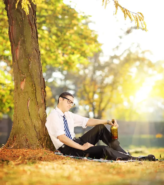 Disappointed man with bottle — Stock Photo, Image