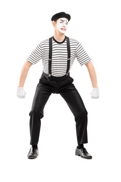 Mime artist lifting something imaginary