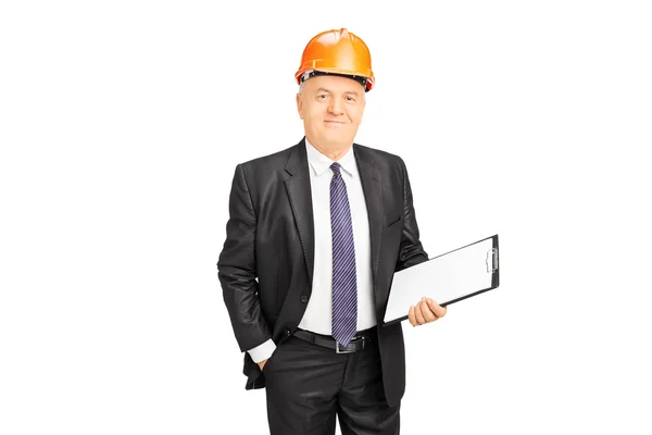 Mature construction worker holding clipboard — Stock Photo, Image