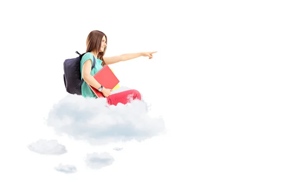 Estudiante apuntando sentado en una nube — Foto de Stock