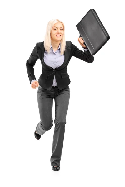 Businesswoman running with briefcase — Stock Photo, Image