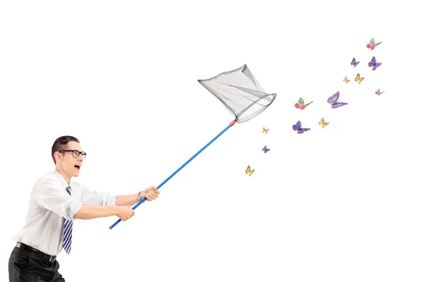 Man catching butterflies with net — Stock Photo, Image